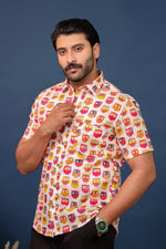 Load image into Gallery viewer, Men wearing pink owl print cotton shirt with quirky handcrafted pattern by Rangat Jaipur.