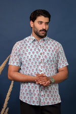 Load image into Gallery viewer, Men wearing sky blue floral hand block printed cotton shirt with traditional Sanganeri print by Rangat Jaipur.