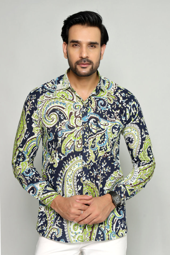 Man wearing a patterned shirt with a gray background