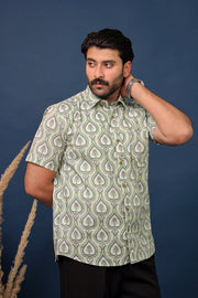 Men wearing green paisley hand block printed cotton shirt with ethnic Sanganeri design by Rangat Jaipur.