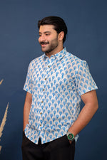 Load image into Gallery viewer, Men wearing white and blue floral hand block printed cotton shirt with traditional Sanganeri print by Rangat Jaipur.