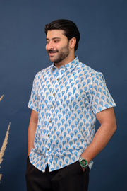Men wearing white and blue floral hand block printed cotton shirt with traditional Sanganeri print by Rangat Jaipur.