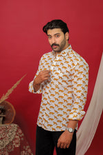 Load image into Gallery viewer, Man wearing a white tiger printed full sleeve shirt with black jeans against a red background.