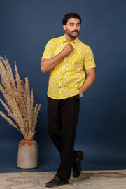 Men wearing yellow ikat print cotton shirt with handcrafted ethnic pattern by Rangat Jaipur.